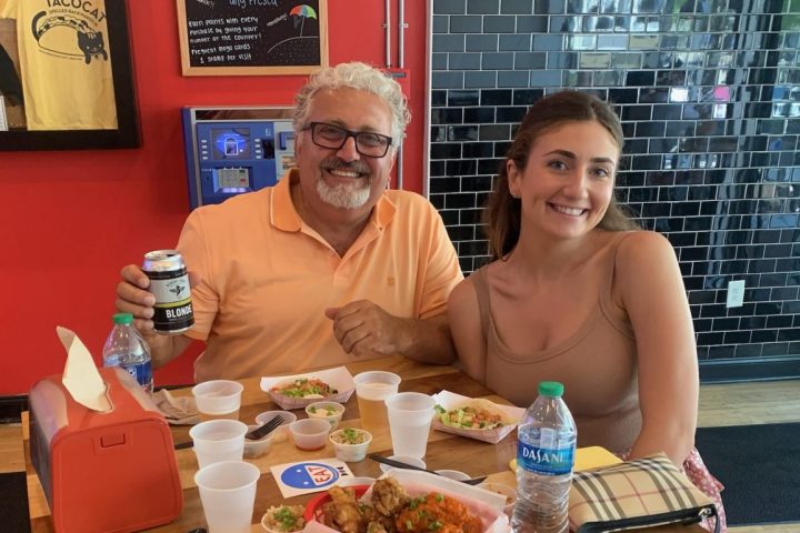 a person sitting at a table with food